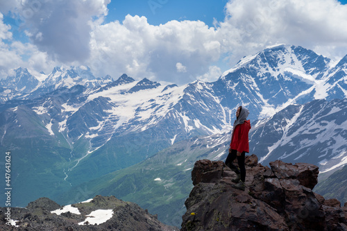 girl posing against the backdrop of mountains. healthy lifestyle, travel.