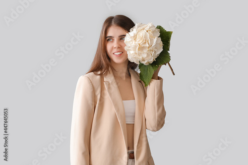 Young woman with hydrangea ...