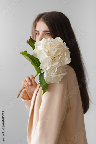 Young woman with hydrangea ...