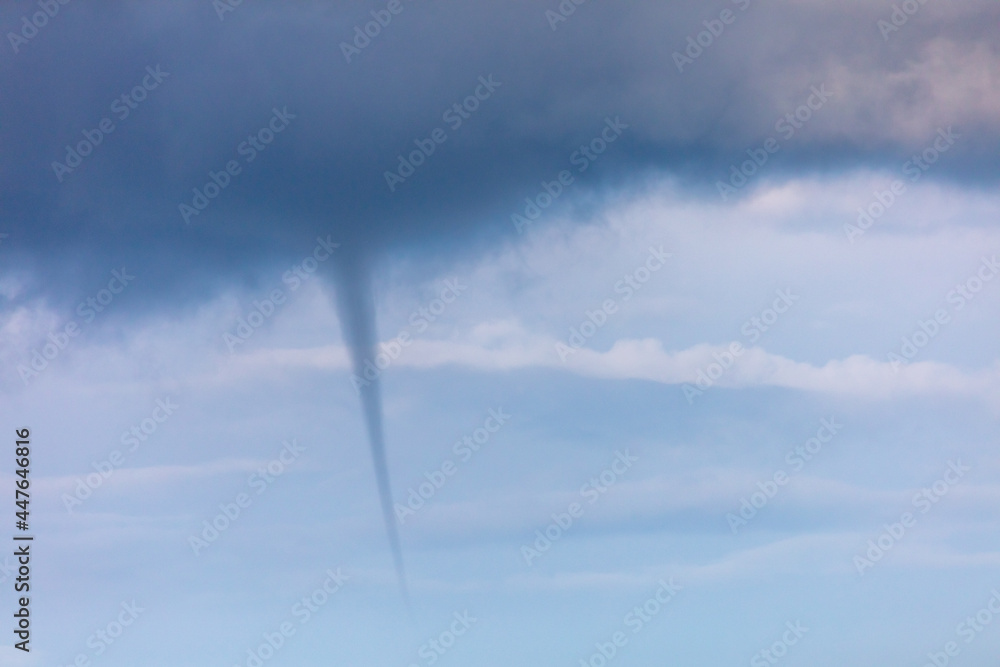 A tornado forms in the clouds. A tornado forms in the clouds.