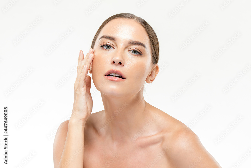 Beauty shot of caucasian woman with youthful fresh clear wrinkle free face skin in isolated studio white background