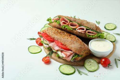 Concept of tasty eating with ciabatta sandwiches on white background