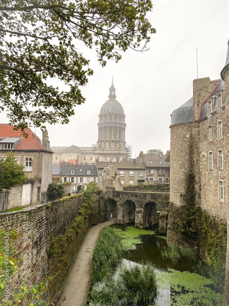 Basilica of Our Lady of the Immaculate Conception at the fortified city of Boulogne-sur-Mer, castle in foreground. Cloudy and rainy day with unrecognizable person
