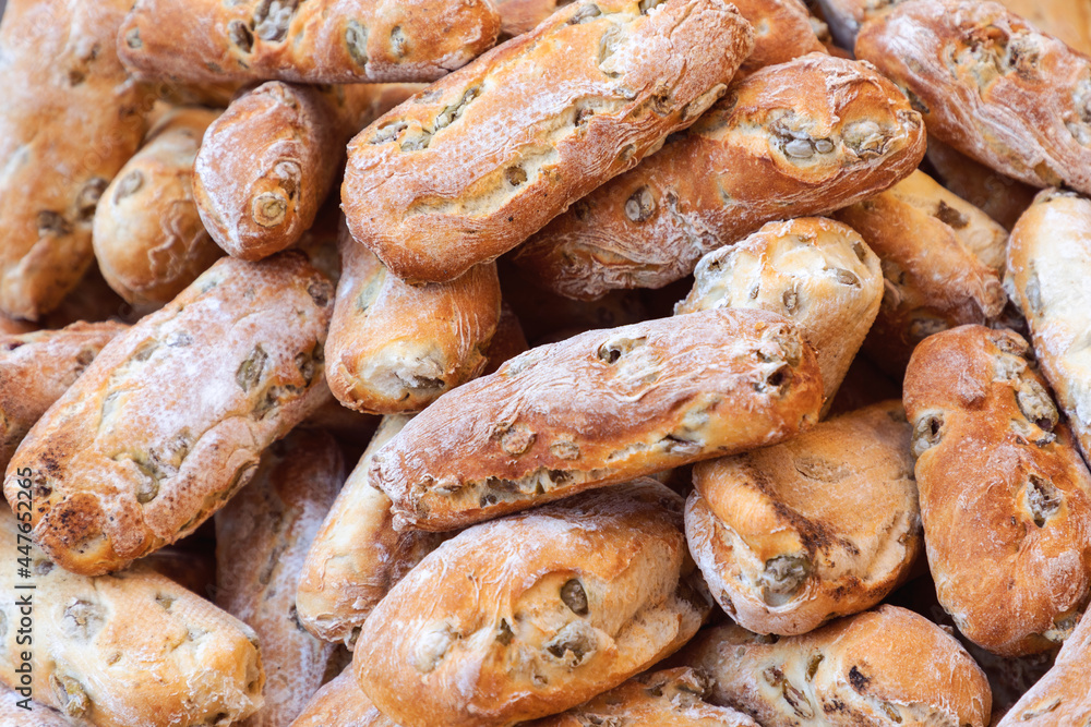 Freshly baked rustic Italian bread with green olives at the Sunday market