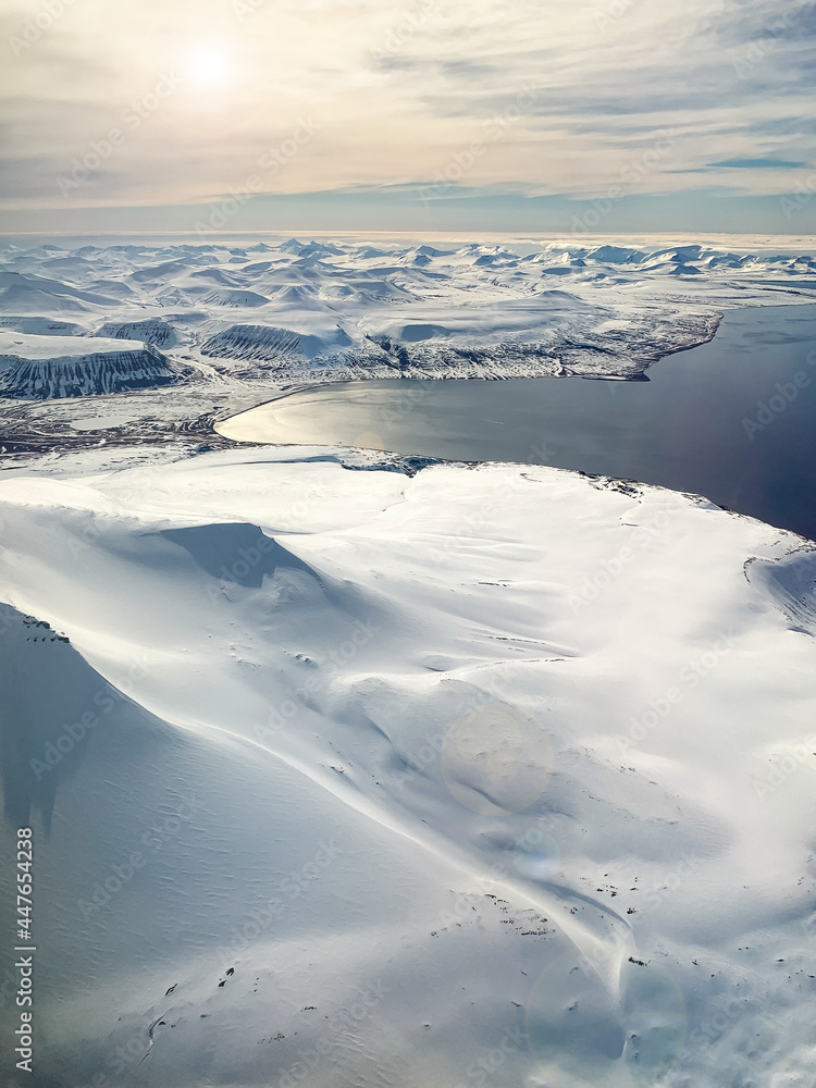 Svalbard snow, mountains and Arctic sea, aerial view