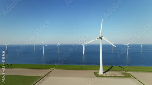 Wind turbines in fields and sea, Urk, Flevoland, Netherlands photo