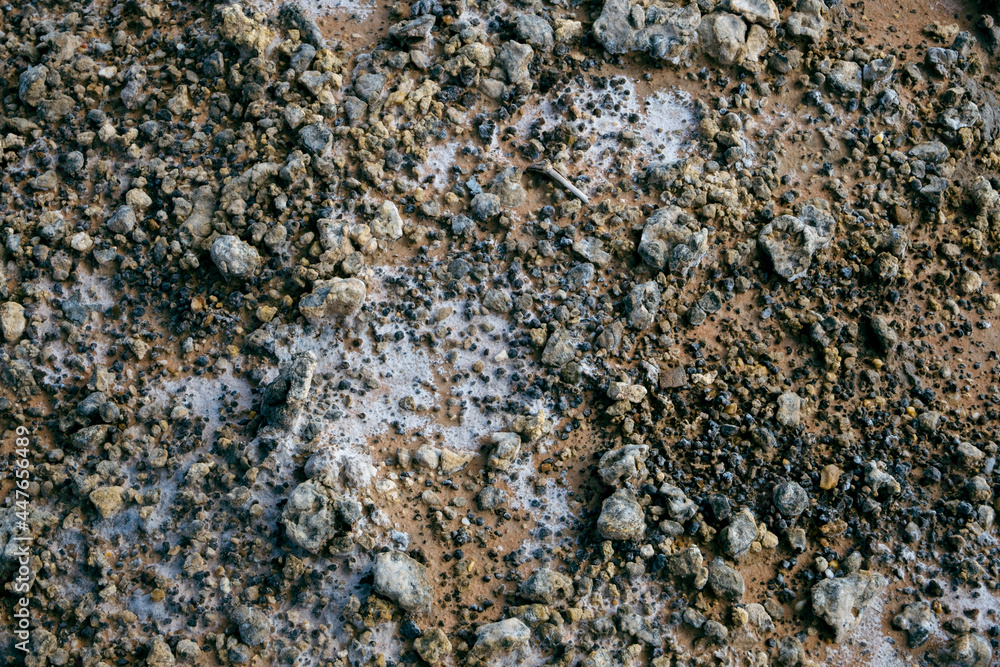 A pile of soil that has been eroded into a large rut when it rains. A pile of soil that has been eroded into a large rut when it rains.