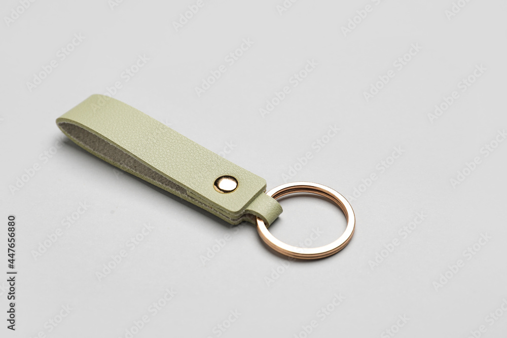 Leather keychain on grey background Leather keychain on grey background