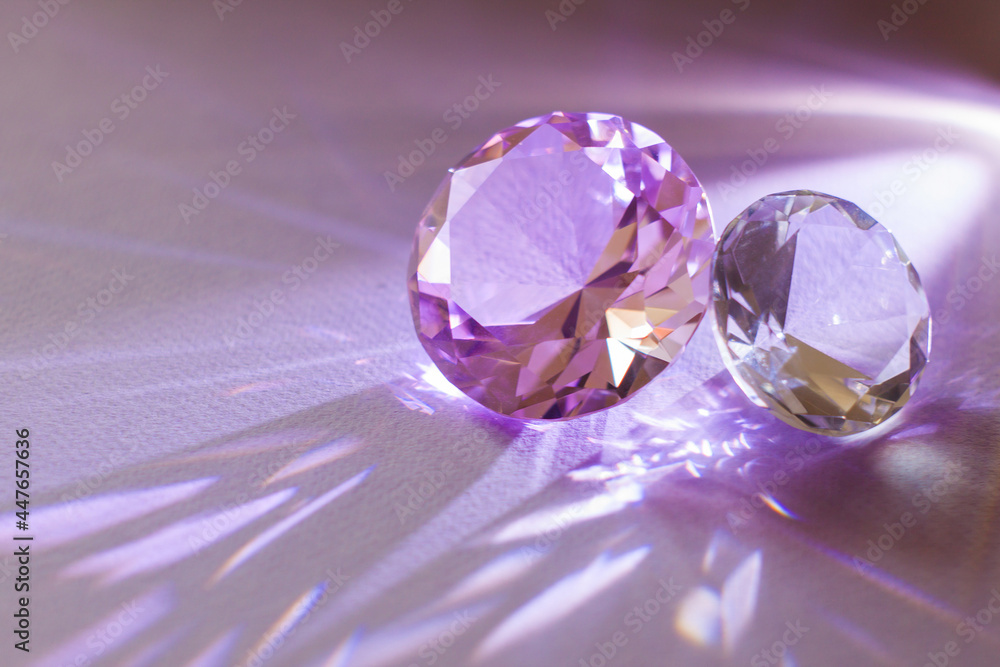 Purple precious gemstones for design gems jewellery. Diamonds crystal on turquoise background. Purple precious gemstones for design gems jewellery. Diamonds crystal on turquoise background.