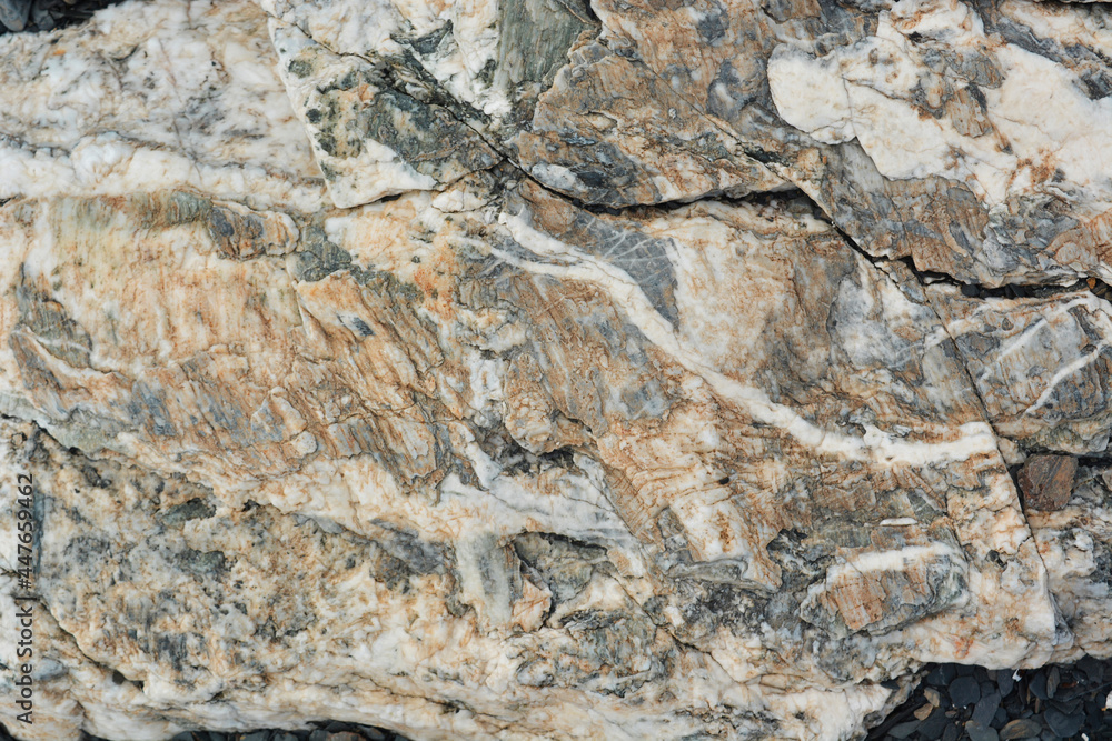 Stone cut with orange-white and gray pattern, close-up Stone cut with orange-white and gray pattern, close-up