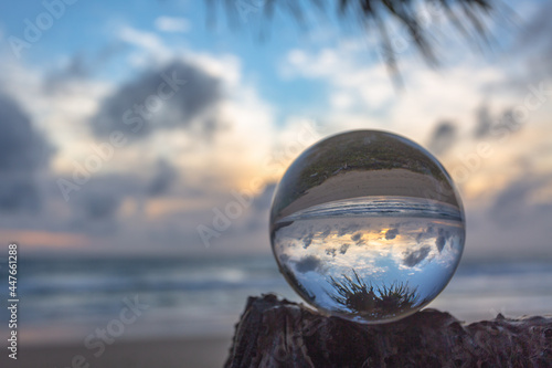 Fototapeta Naklejka Na Ścianę i Meble -  Unconventional and beautiful natural views of the sea in a magic crystal ball. Nature video High quality footage..Unique and creative travel and nature idea videos 4K clips.