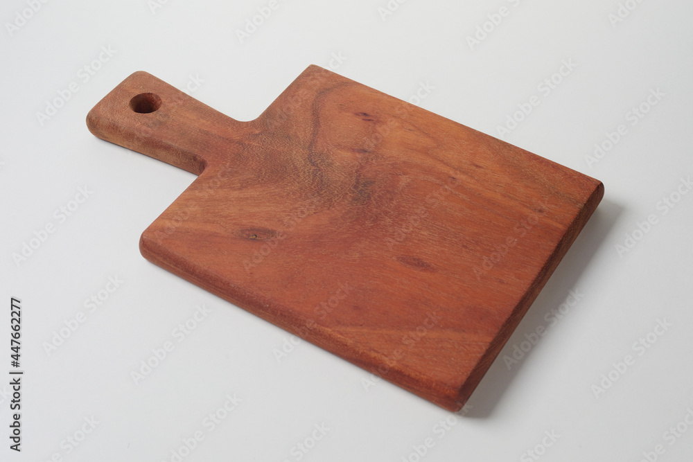 Fototapeta premium Wooden chopping board on gray table