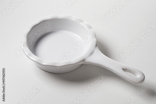 Ceramic saucepan placed on table