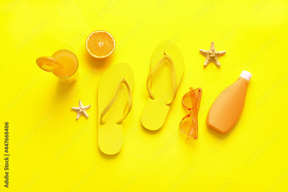 Composition with flip-flops, sunglasses, sunscreen and glass of juice on color background Composition with flip-flops, sunglasses, sunscreen and glass of juice on color background