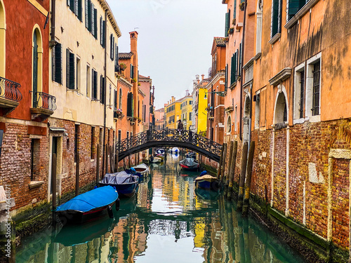 Unrecognizable person walking on a bridge in Venice, Italy