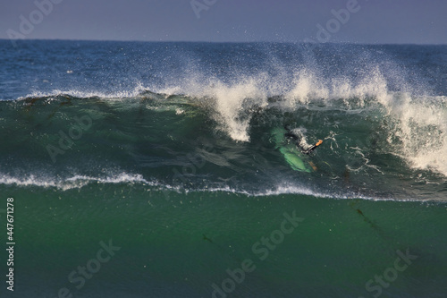 Surfing big summer waves at Leo Carrillo state beach photo