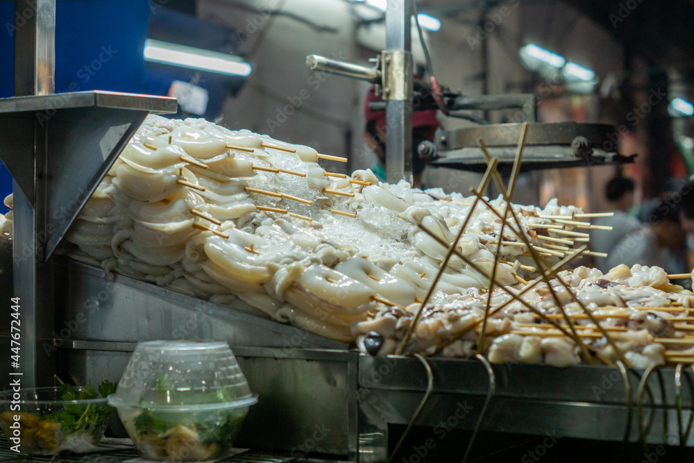 Food grilled skewers grilled squid, The most popular out of the grill.are popular with many people. They are sold in general street shops in Thailand. Squid skewers, fresh squid, Coleoidea, Mollusca