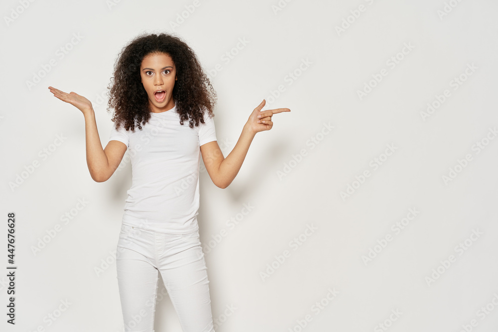 woman with curly hair gesturing with her hands casual clothes woman with curly hair gesturing with her hands casual clothes