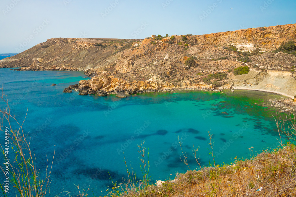Scenic Coastline of Malta. Static View, Fomm Ir-Rih Bay, Turquoise Mediterranean Sea and Rocky Cliffs on Sunny Day