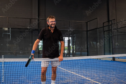 Portrait of beautiful play padle man ready to paly in the padle or tennis court