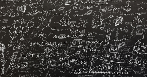 Image of white structural formulae of chemical compounds on blackboard