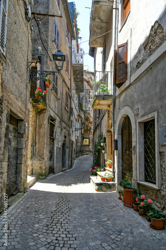 Fototapeta Naklejka Na Ścianę i Meble -  Carpineto Romano, Italy, July 24, 2021. A street in the historic center of a medieval town in the Lazio region.