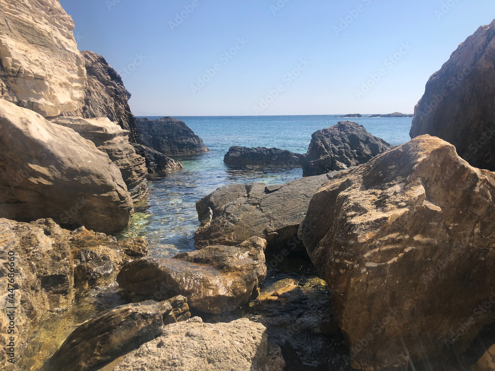 View of the sea in a sunny day among the rocks View of the sea in a sunny day among the rocks