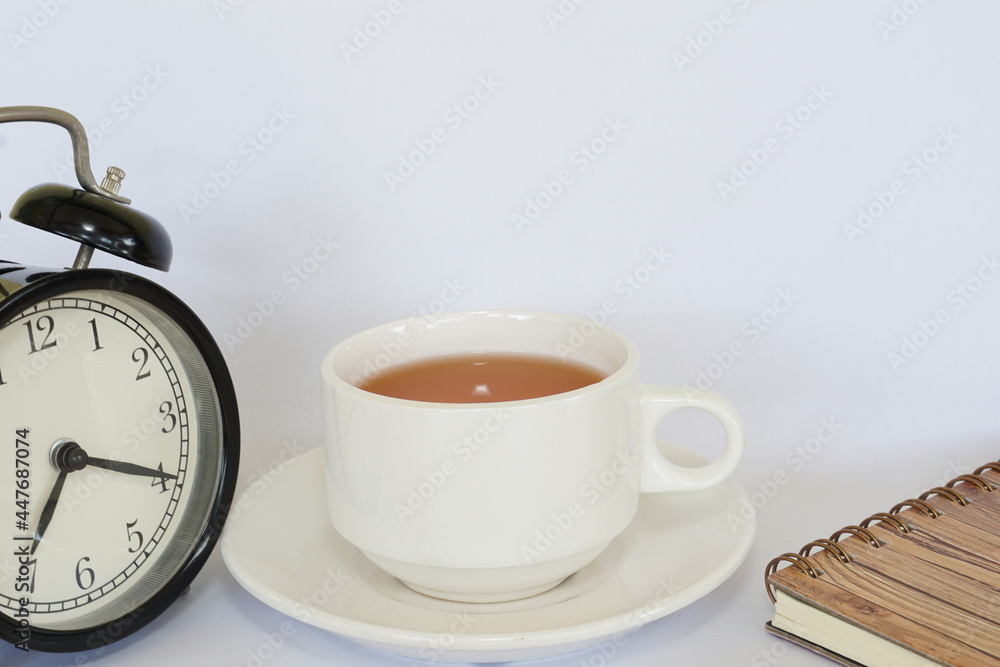 a cup of tea with alarm clock a cup of tea with alarm clock