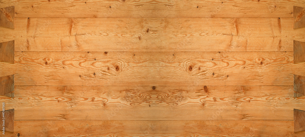 Alpine lifestyle, chalet style, log wall cladding made of reclaimed larch wood, chopped, brushed, natural - old brown wood background Alpine lifestyle, chalet style, log wall cladding made of reclaimed larch wood, chopped, brushed, natural - old brown wood background