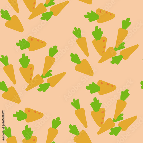 seamless pattern with the image of small carrots on a pink background. warm colors. suitable for clothes, notebooks, wrapping paper