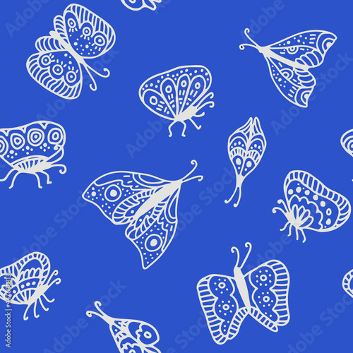 seamless pattern depicting butterflies moths with lines in doodle style. blue background. suitable for printing wrapping paper, clothing, for decorating web pages