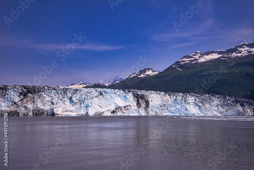 A view of the ice shelf in summer. Little snow on the top of the mountain. Enjoy the view of the ice shelf from the cruise ship. Alaska, USA. July 2019.