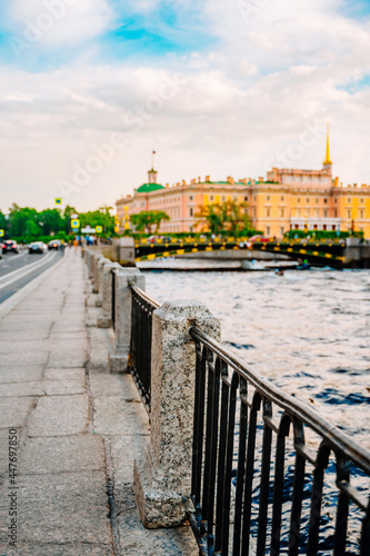 Beautiful view of the Neva river canal in the city center with tourist excursion boats, postcard view. Saint Petersburg, Russia - 11 June 2021