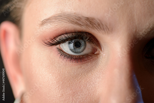 Fototapeta Naklejka Na Ścianę i Meble -  Close-up portrait of young woman with smoky eyes makeup.