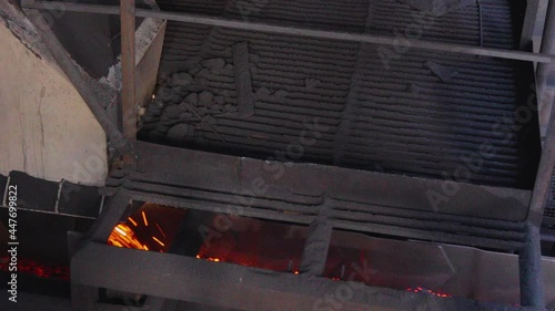 Coal coking process, coke oven coal making process. Hot coke coal leaves the furnace. photo