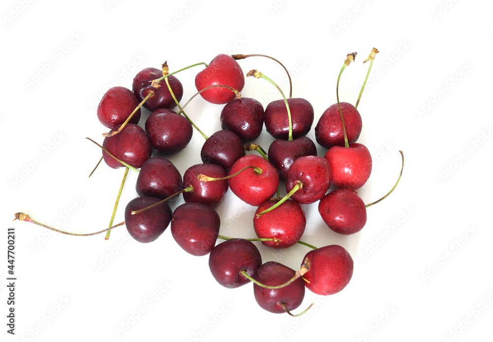 Ripe sweet cherry with water droplets on light background Ripe sweet cherry with water droplets on light background