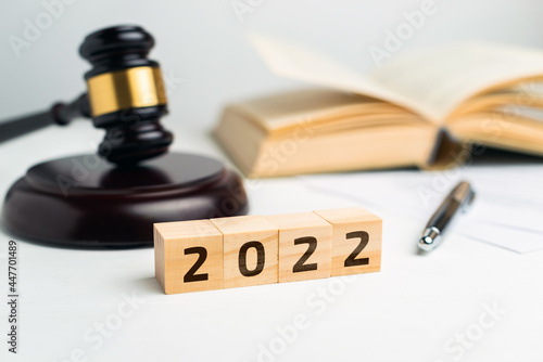 Tela Concept of the court and law with a judge's gavel in 2022 year