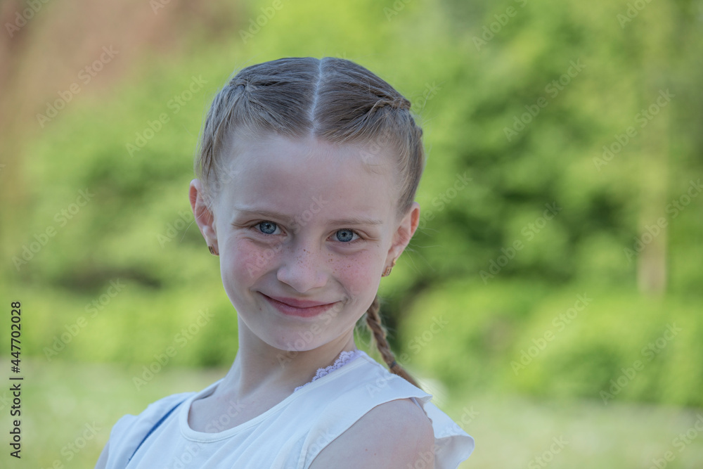Beautiful happy young girl in nature. Close up portrait Beautiful happy young girl in nature. Close up portrait