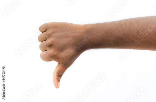 Thumbs down, dislike, disagree sign with male hand on isolated white background