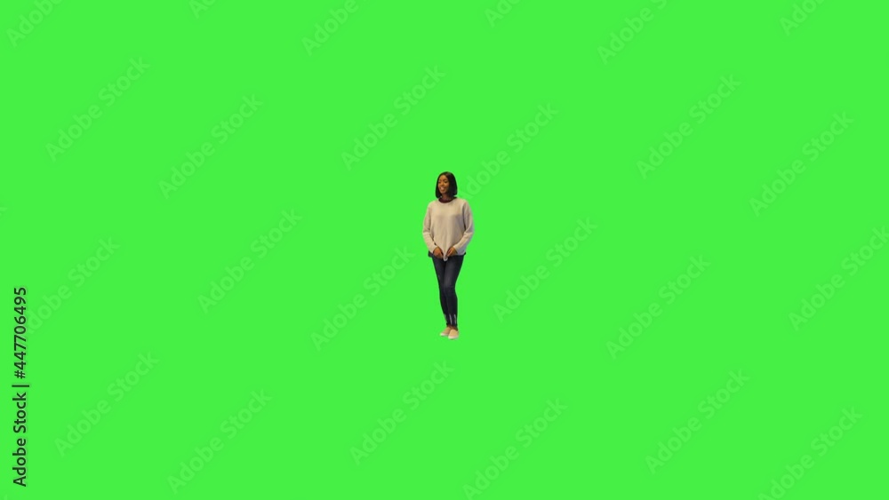 Back view of casual young woman brunette with black hair of african american ethnicity walk away on a Green Screen, Chroma Key. Back view of casual young woman brunette with black hair of african american ethnicity walk away on a Green Screen, Chroma Key.