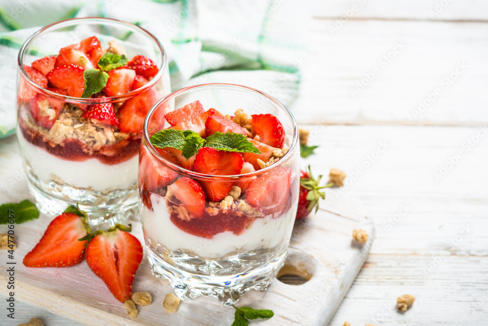 Parfait dessert. Yogurt with fresh strawberry and granola. Parfait dessert. Yogurt with fresh strawberry and granola.