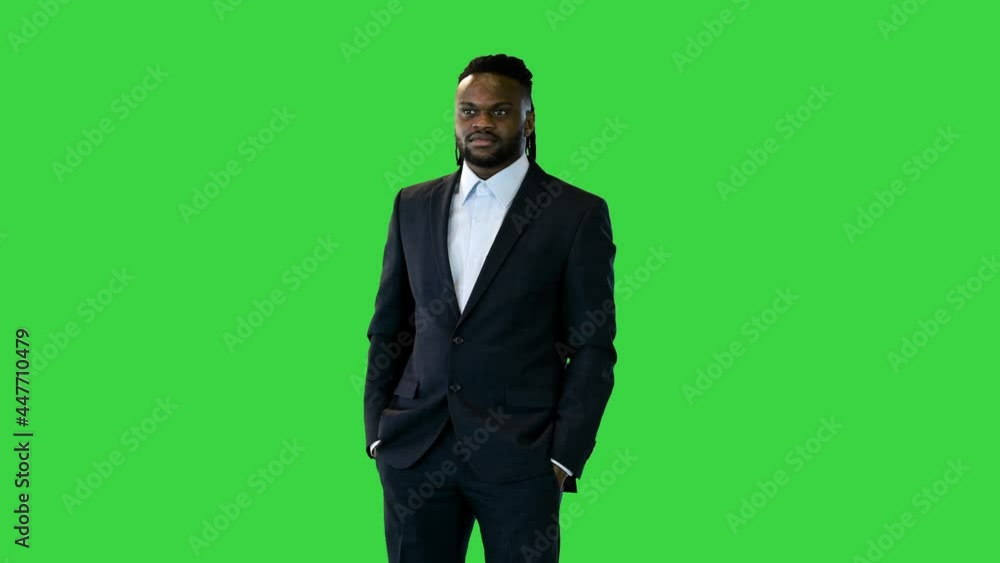 Black man in office suit having a conversation on a Green Screen, Chroma Key. Black man in office suit having a conversation on a Green Screen, Chroma Key.