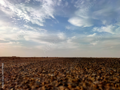 Asphalt road beside Sahara desert, Laayoune, Morocco photo