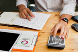 Financial businessman accounting calculating cost economic budget in home office. Investment and saving concept.