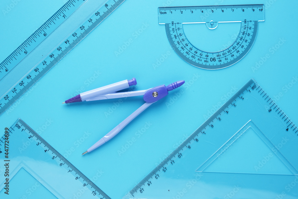 A picture of geometry set with copyspace sticky note on blue background. Engineering and Mathemetics concept A picture of geometry set with copyspace sticky note on blue background. Engineering and Mathemetics concept