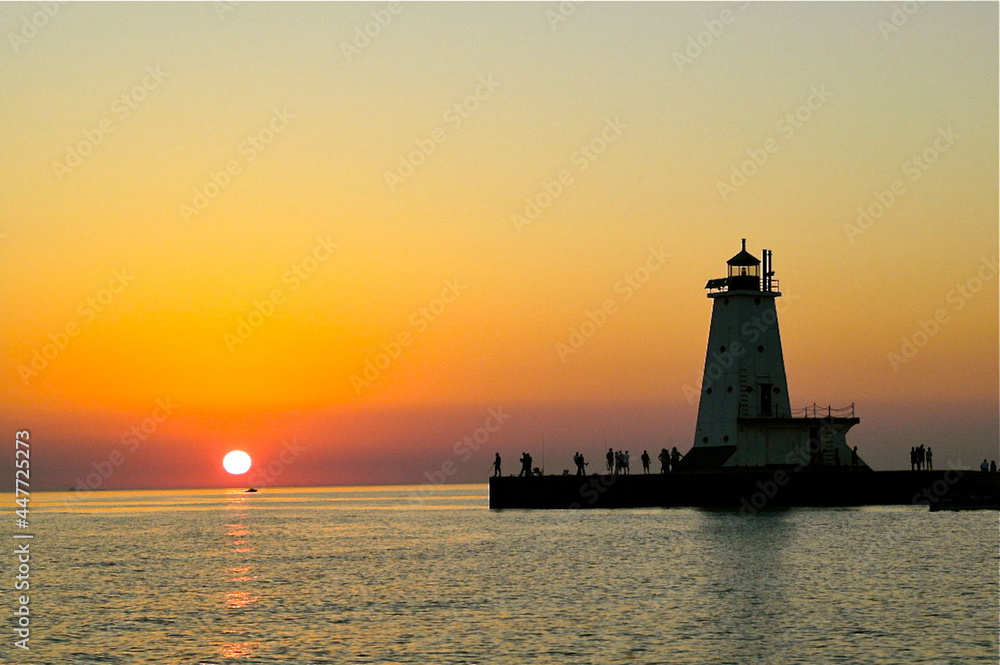A solitary boater at sunset on Lake Michigan