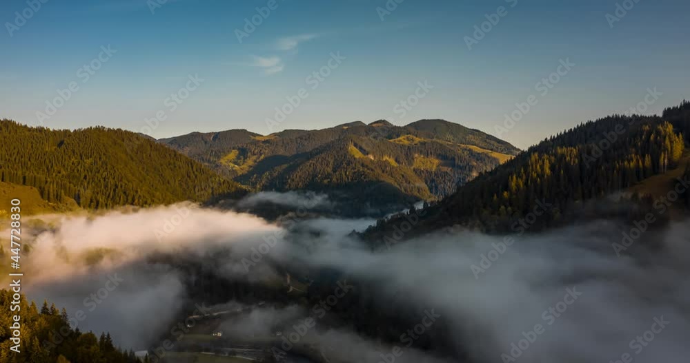 Aerial drone hyperlapse timelapse of autumn morning in mountains. Clouds form in the valley and carried forward by the wind. Picturesque landscape of Carpathians. Aerial drone hyperlapse timelapse of autumn morning in mountains. Clouds form in the valley and carried forward by the wind. Picturesque landscape of Carpathians.