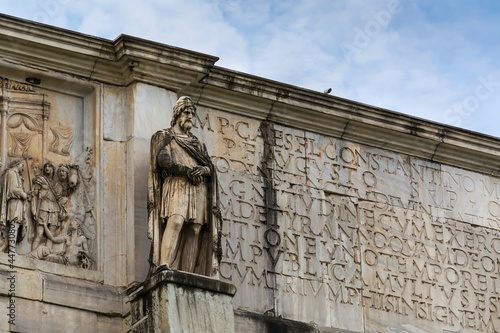 Marble statue of a Dacian warrior surmounting the Arch of Constantine (Arco de Constantino), Rome, Italy photo