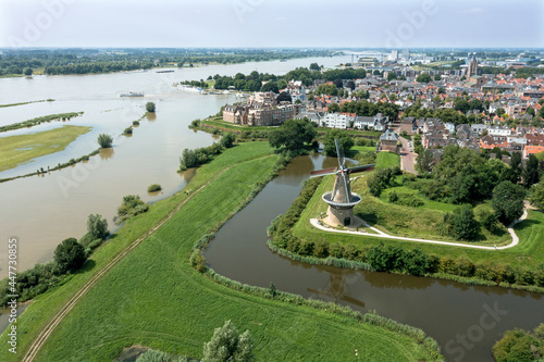 Aerial from the city Woudrichem at the river Merwede in the Netherlands in a flooded landscape