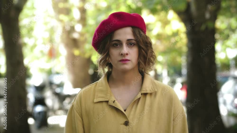 thoughts, problems - young pensive woman stares serious at camera thoughts, problems - young pensive woman stares serious at camera